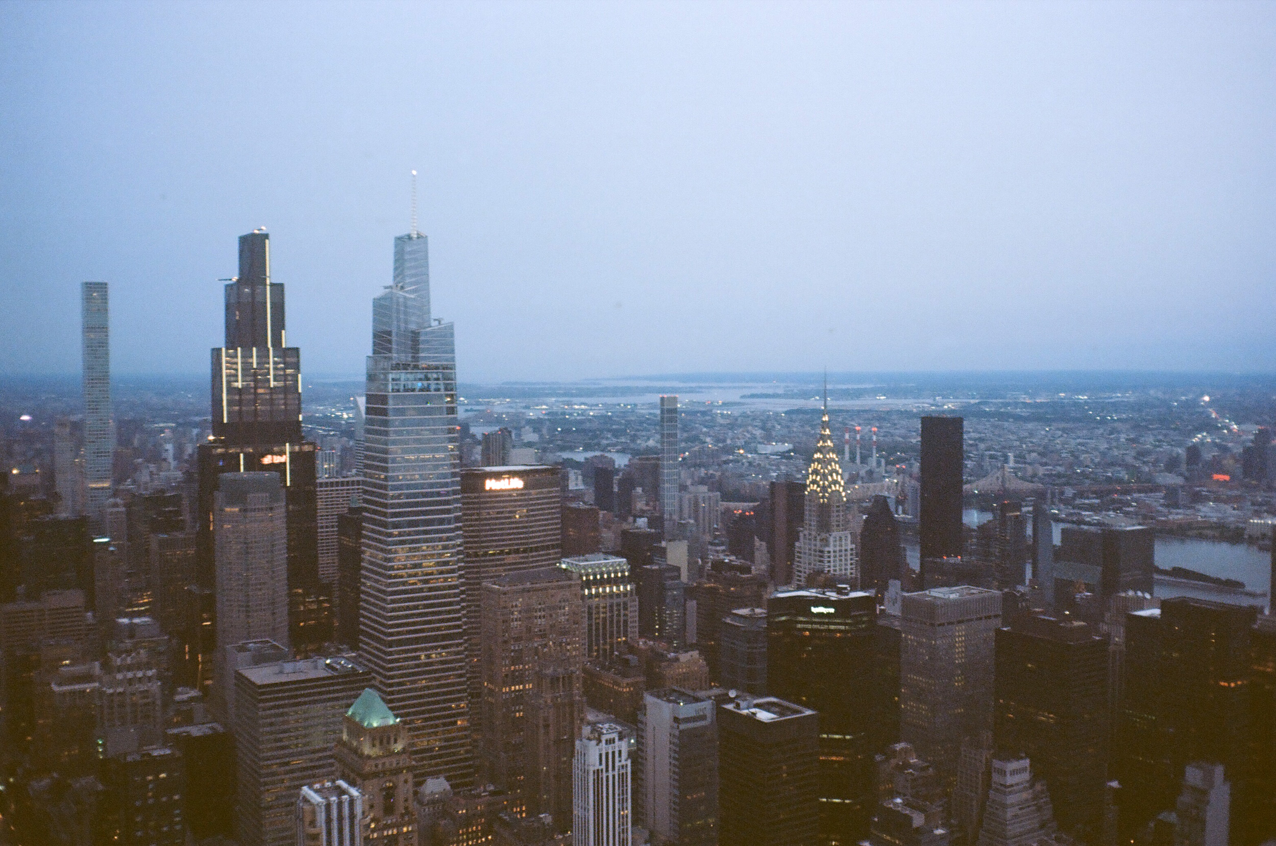 The New York City skyline, including the Chrysler Building, from atop the Empire State Building - foggy and dreary and dark